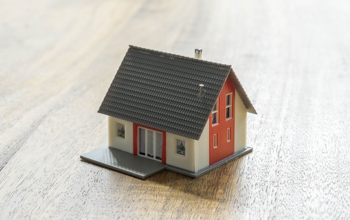 model of a small house on a wood table