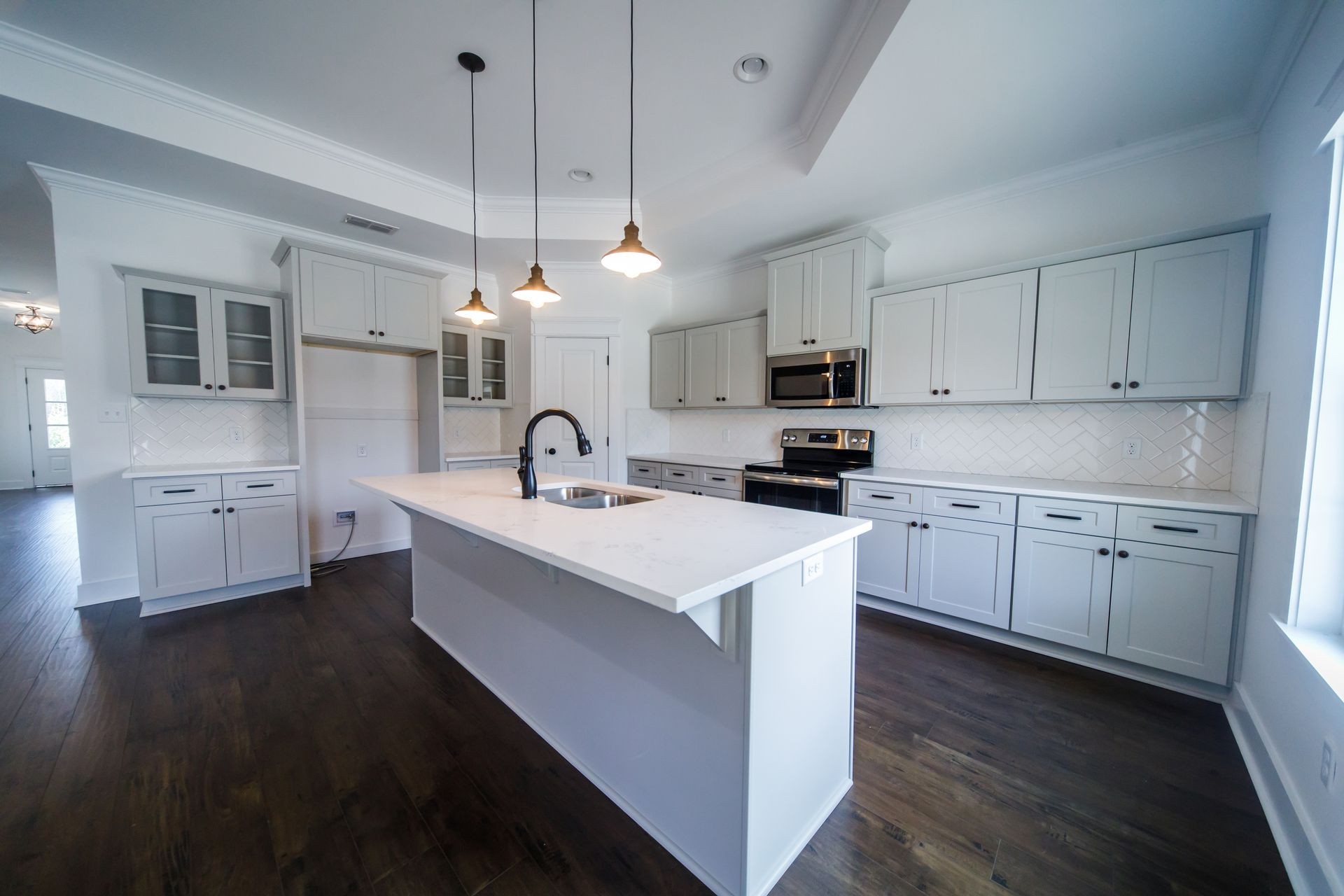 Modern new Construction White Kitchen Grey cabinets stainless sink
